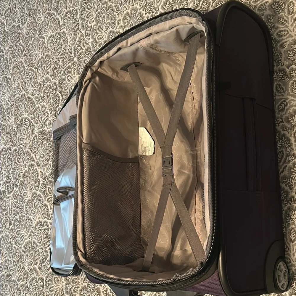 American Tourister Purple Carry-On Rolling Suitcase
